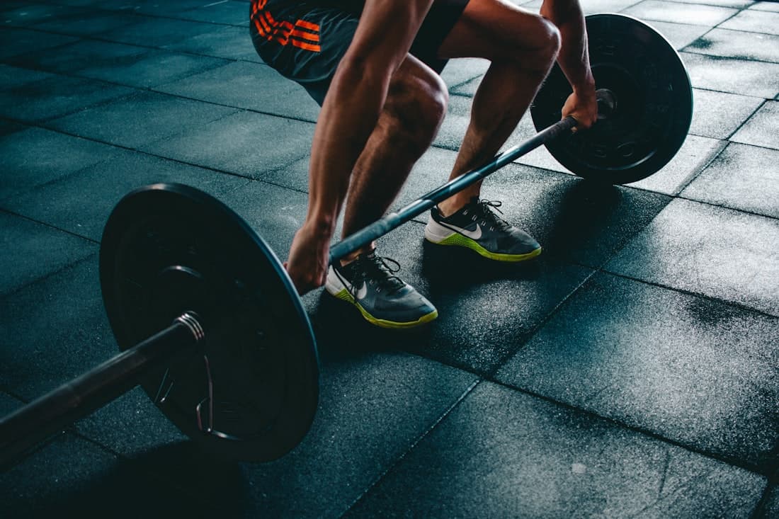 An athlete setting up for a heavy deadlift